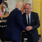 President Donald Trump and HHS Secretary Robert F. Kennedy Jr. attend an event for the release of a new Make America Healthy Again Commission report on May 22.