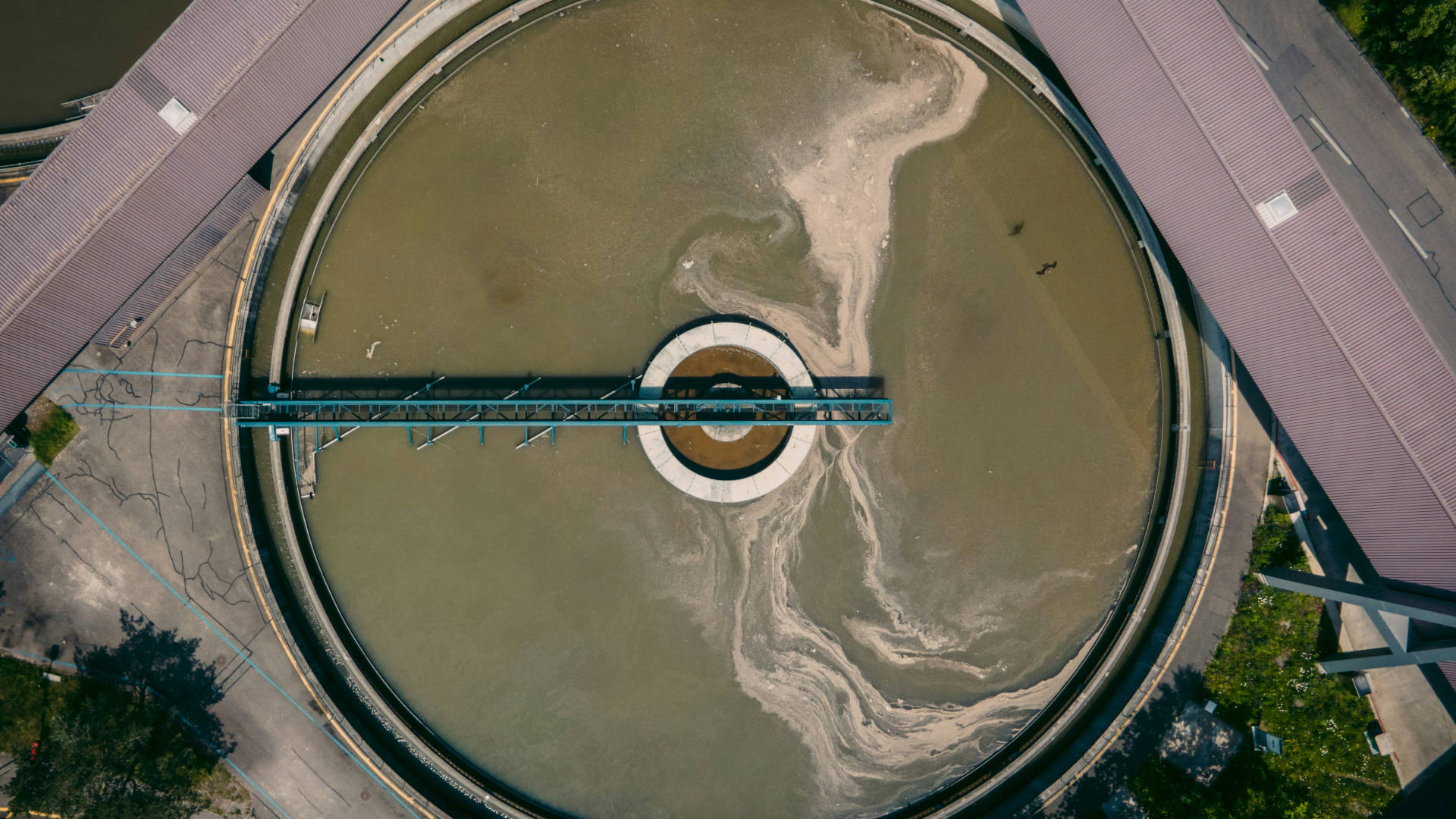 Aerial view of a sewage treatment plant tank.