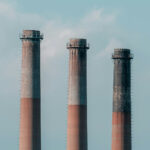 three smokestacks at a power generation station