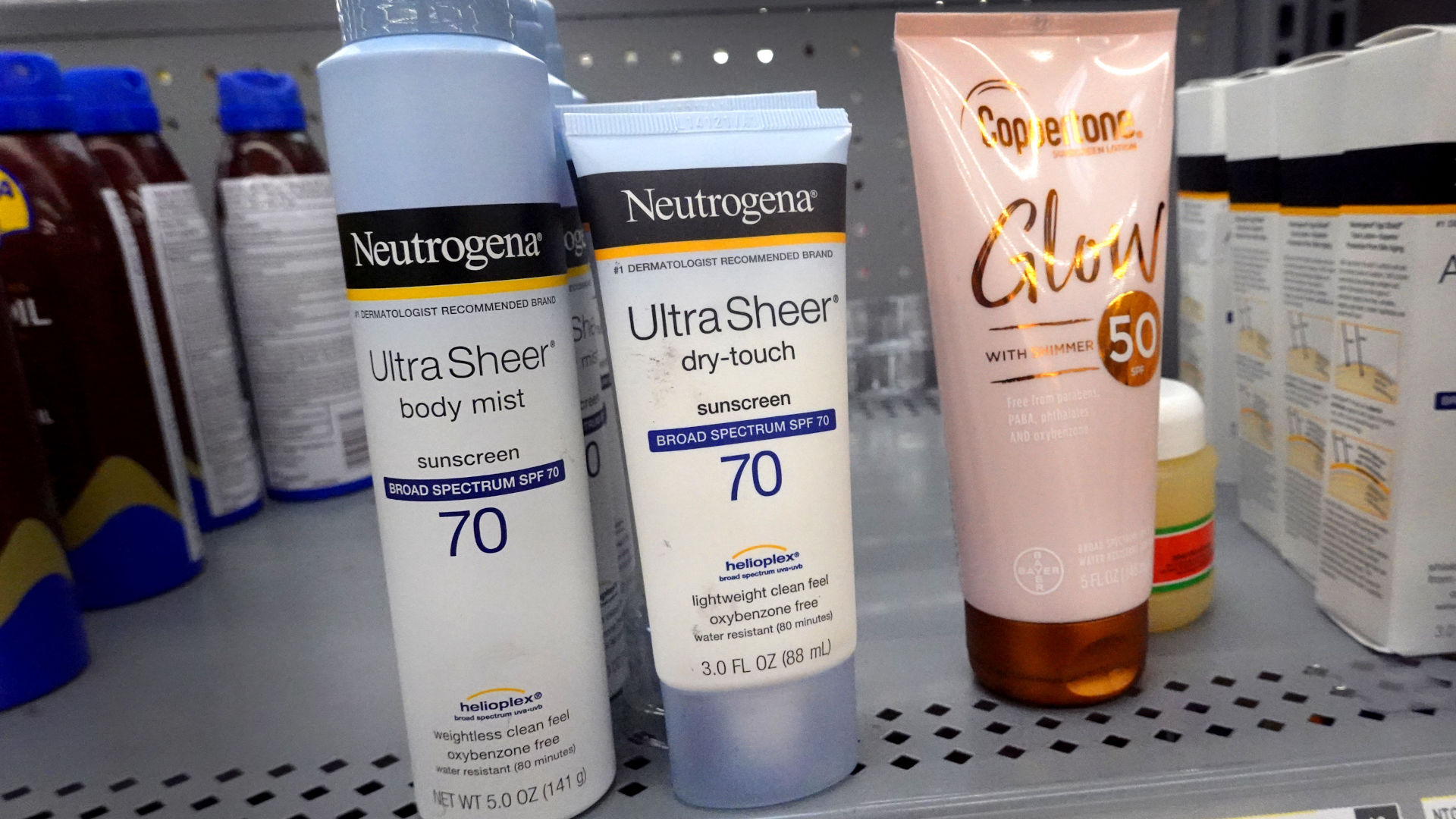 bottles of sunscreen on a store shelf