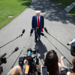 Donald Trump on south lawn of white house talking to reporters