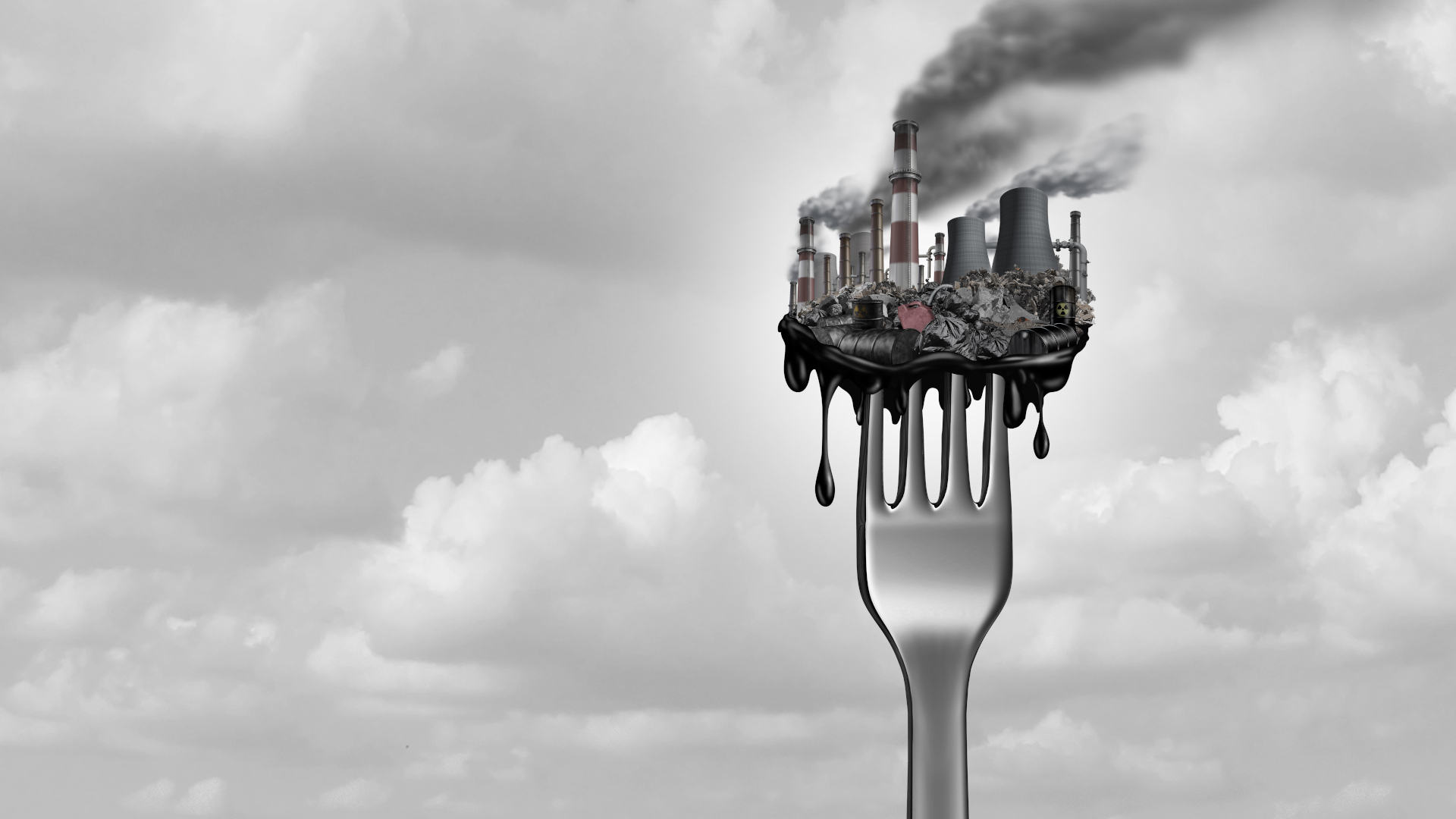 A fork with industrial toxins stacked upon it sits against a cloudy background