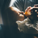 Dad Feeding his Baby Boy with Milk Bottle
