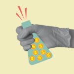 A hand in a medical or laboratory glove holds a laboratory flask with coins with dollar sign.