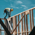 construction worker against a blue sky