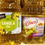 Cooking oils made from canola, sunflowers and soybeans are offered for sale at a grocery store