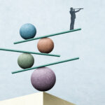 Man with spyglass stands on top of a series of balanced seesaws