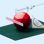 A conceptual image featuring a simple geometric icosphere being measured with a ruler, triangle ruler, and caliper. The composition symbolizes meticulous planning, technical accuracy, and the process of turning abstract designs into tangible results, reflecting the theme “Plans Come to Life.” Each measuring tool highlights careful calculation, structural assessment, and design precision, emphasizing the transformation from concept to execution. The minimalist geometric layout conveys ideas of creativity, engineering, and systematic realization of architectural or technical projects.