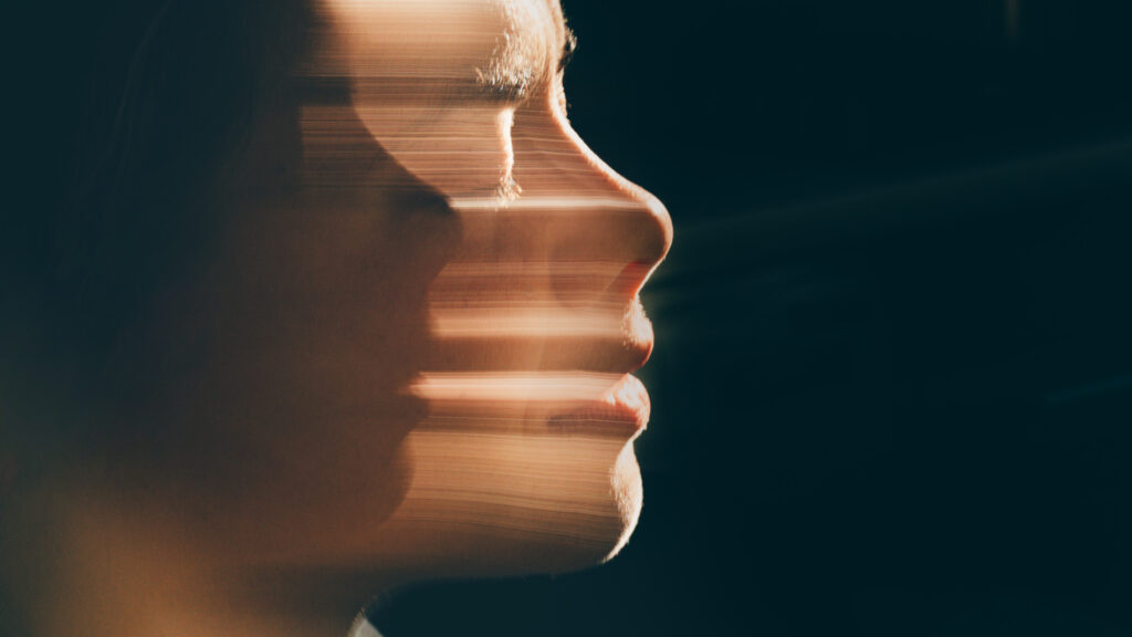 Artistic human face motion blur portrait.