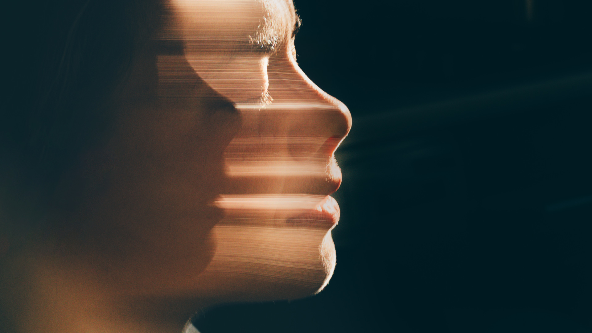 Artistic human face motion blur portrait.